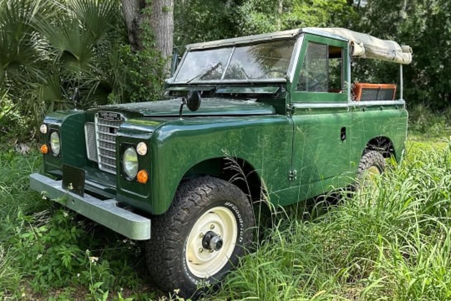 1972 Land Rover Series II Santana among a group of Landies at Mecum Indy