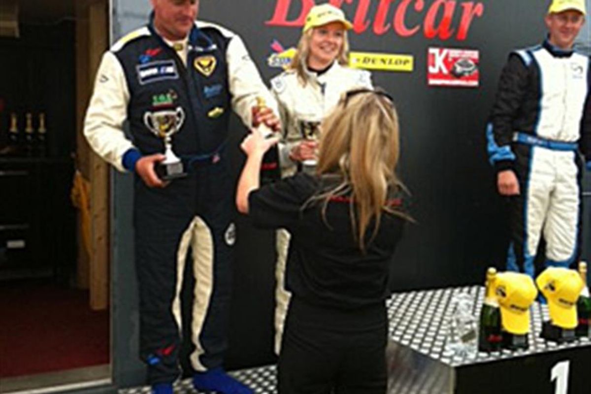Sarah on podium in Adrian Flux BMW M3