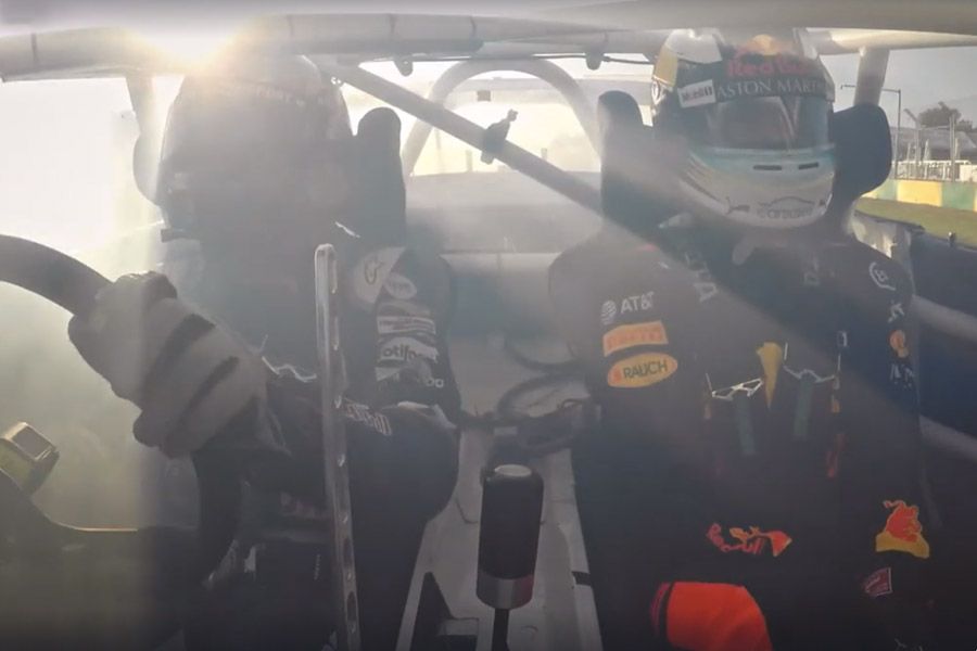 Daniel Ricciardo drifts around the Melbourne circuit with Mad Mike Whiddett