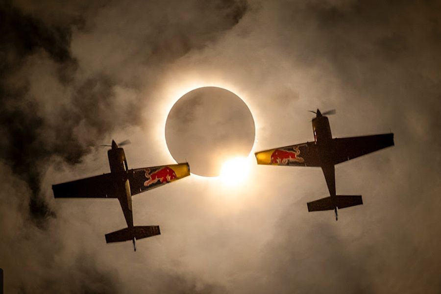 Red Bull Aerobatic Pilots Fly Through Rare Solar Eclipse,